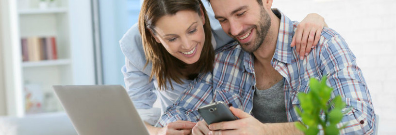millennial couple on laptop