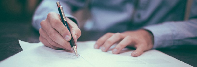 Man signing document