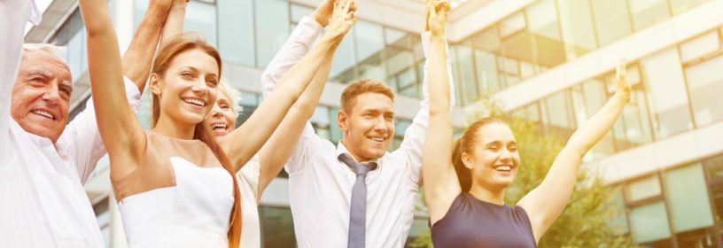Employees celebrating with arms up