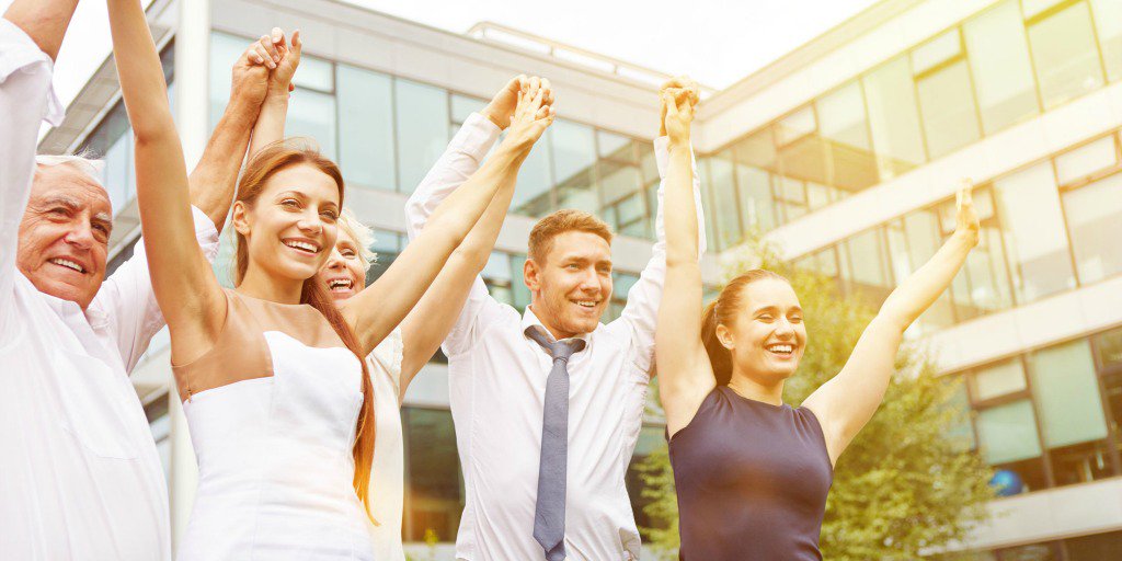 Employees celebrating with arms up