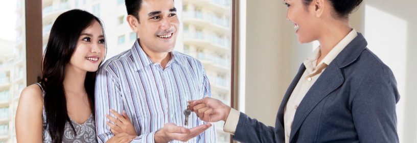 Millennial Buyers Receiving Keys from Agent