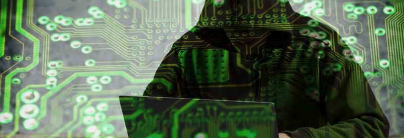 Man hacking data on laptop