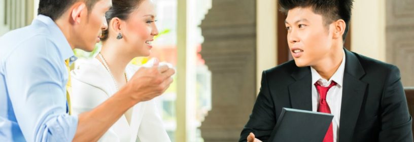 Foreign couple with real estate agent