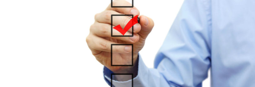 man checkmarking real estate eo options