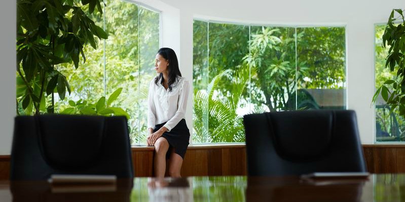 woman-looking-out-of-new-office