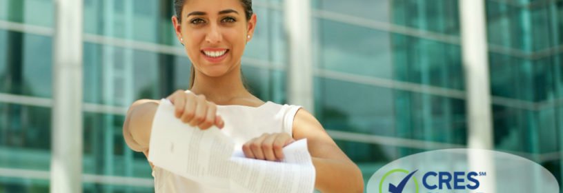 woman real estate agent tearing up lawsuit