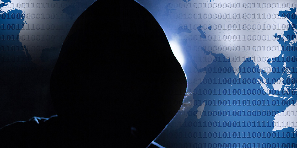 dark hooded person cyber background