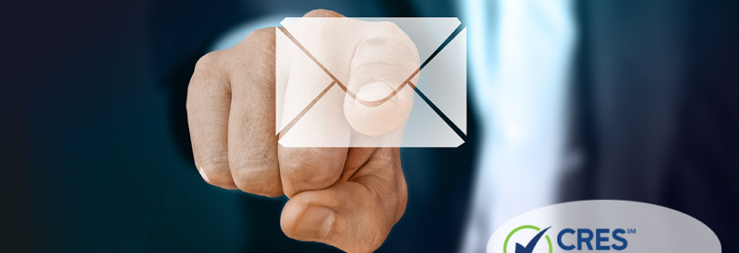 finger touching email envelope
