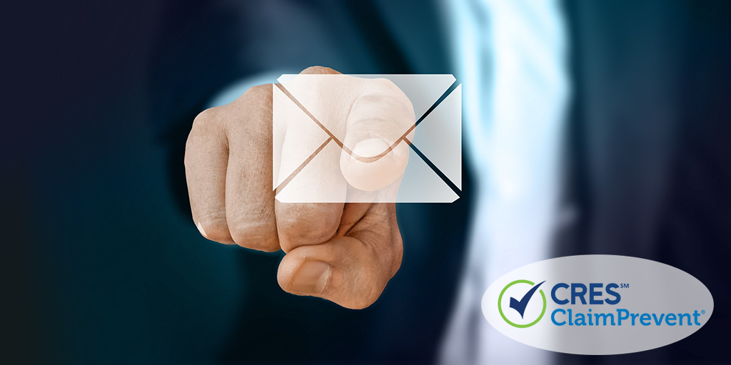 finger touching email envelope