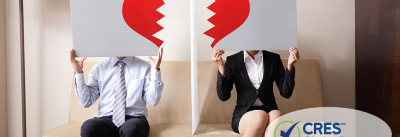 divorced couple sitting on couch holding broken heart images