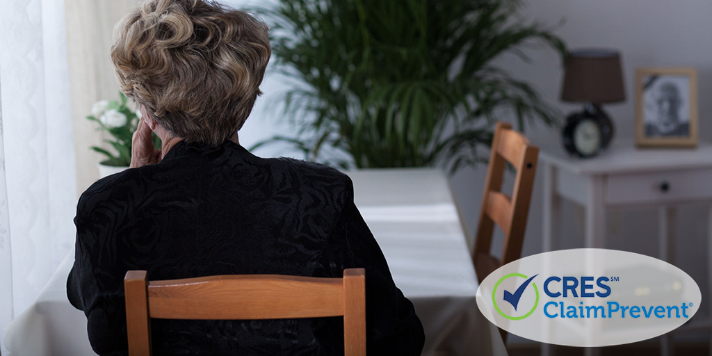 woman sitting at table in house