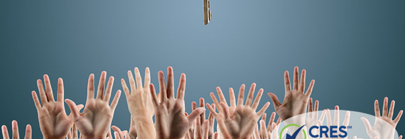 many hands reaching for one key