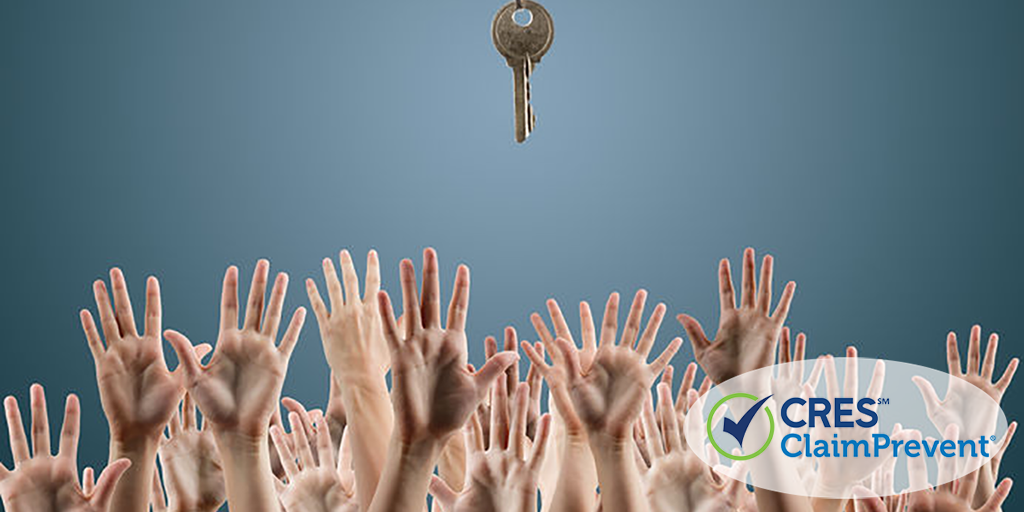 many hands reaching for one key