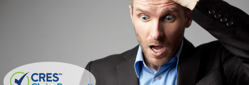 man surprised with hand on head