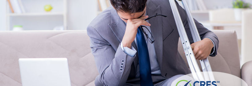 distraught real estate agent with crutches