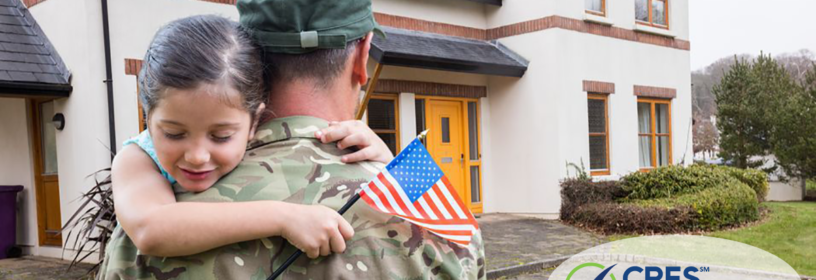 man and daughter with flag in front of house