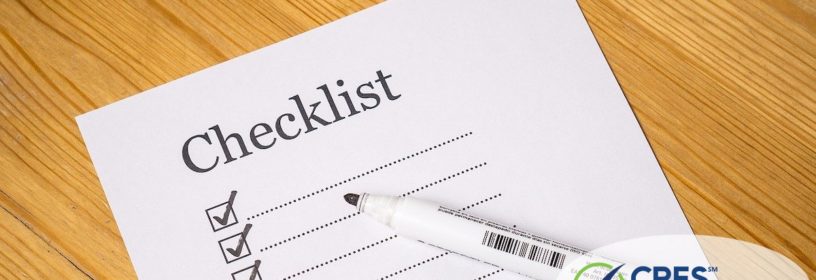 paper on desk with checklist and checkmarks