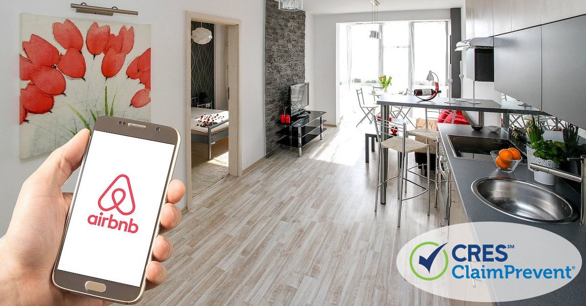 apartment property with person holding smartphone showing airbnb logo