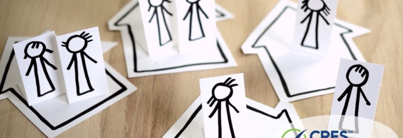 paper houses with stick people in each one