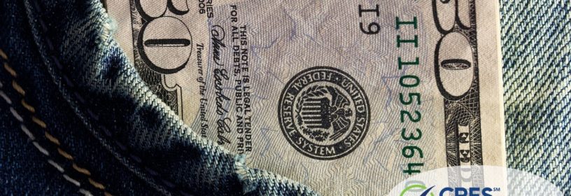 jeans pocket with $50 bill sticking out