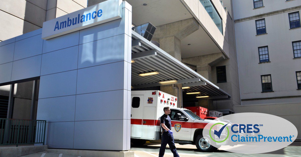 hospital with ambulance parked next to the building