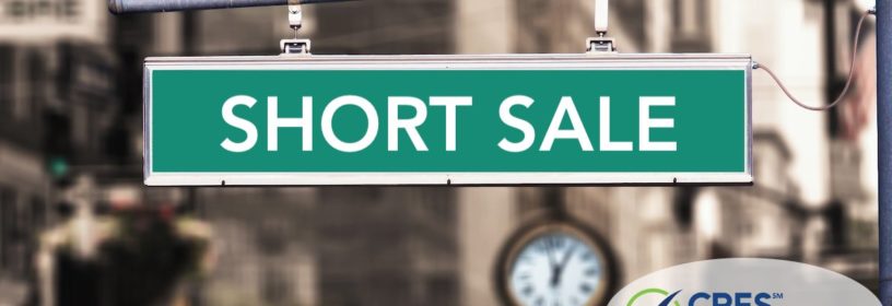 city road with green sign that says short sale