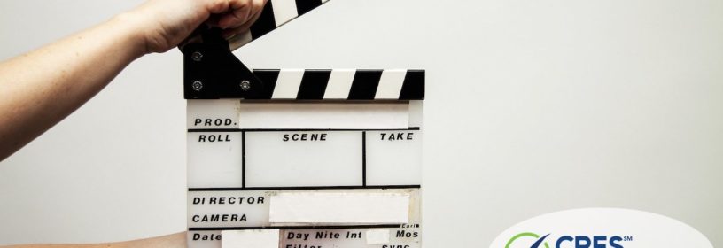 hands holding movie clapperboard