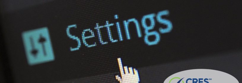 computer screen with mouse pointing to settings link on website dashboard