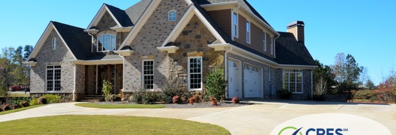 large brick house with circular driveaway
