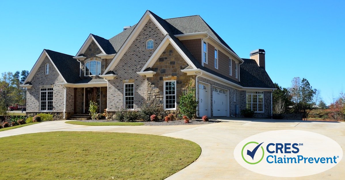 large brick house with circular driveaway