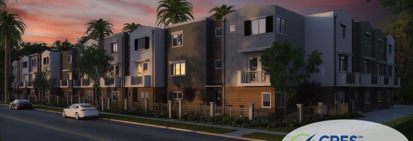 condo complex with palm trees and sunset