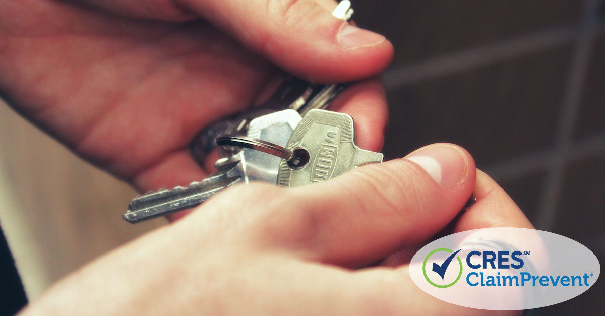 hands holding a set of keys