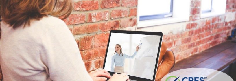 woman on laptop watching a seminar