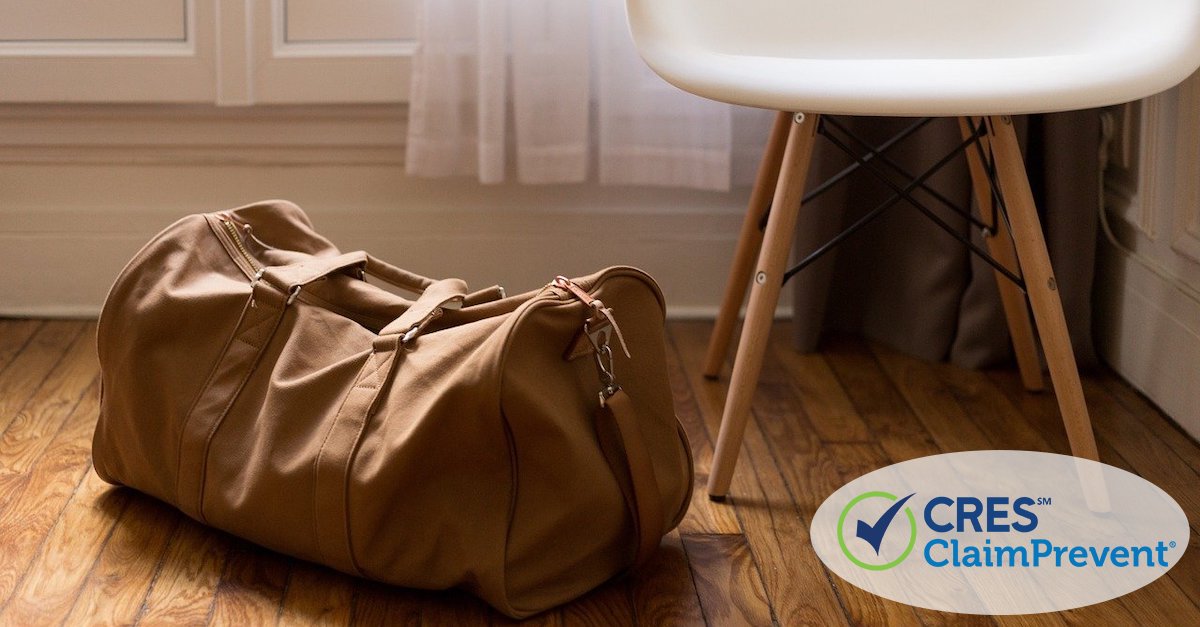 duffel bag next to chair in room