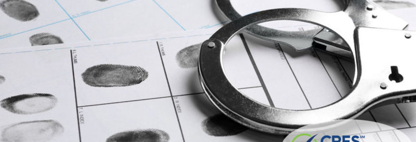 handcuffs laying on fingerprint cards