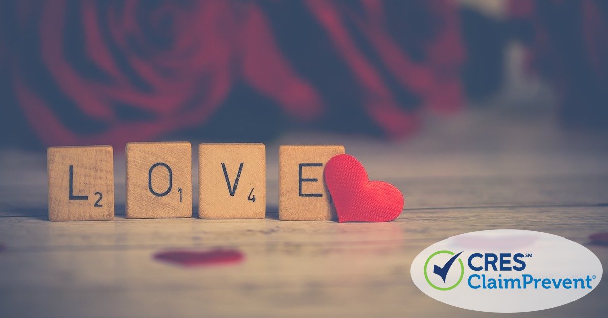 scrabble blocks that spell love with a red heart next to it