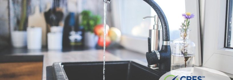 kitchen faucet with water coming out of it