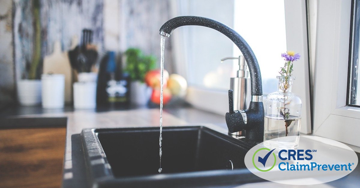 kitchen faucet with water coming out of it