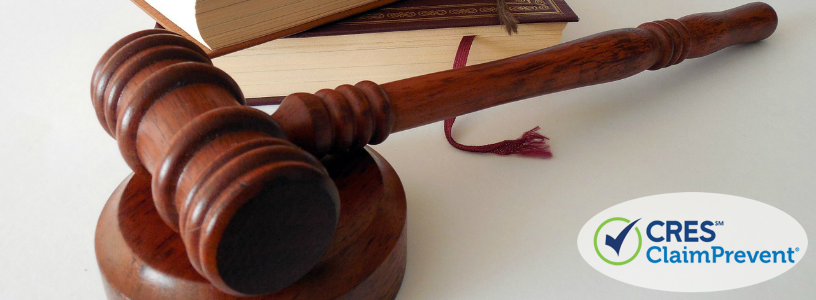 law gavel with law book on desk