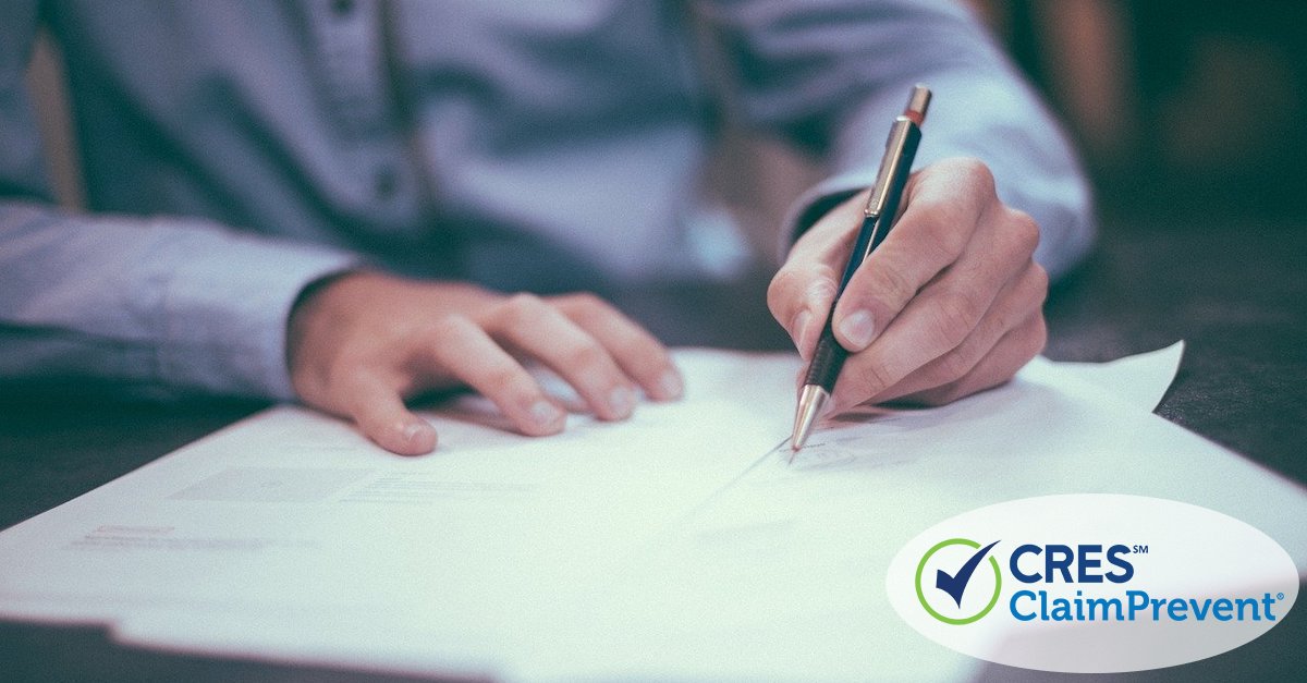 man filling out application paperwork at a desk