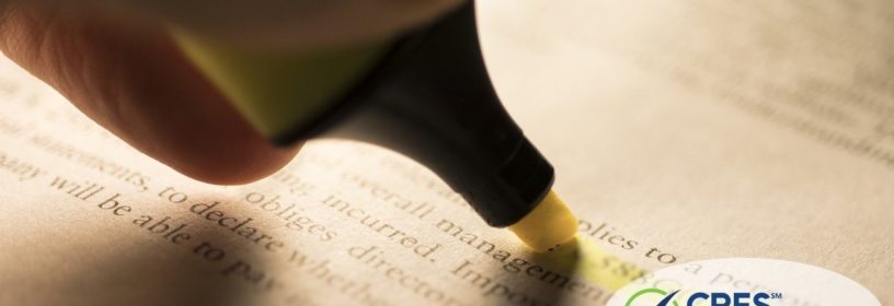 person highlighting legal language in a book