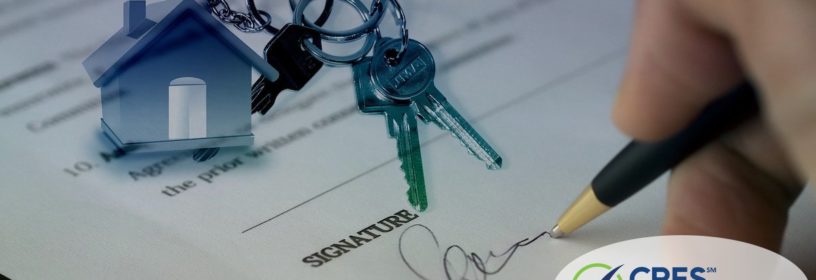 person signing house sale contract with image overlaid of house keychain and keys