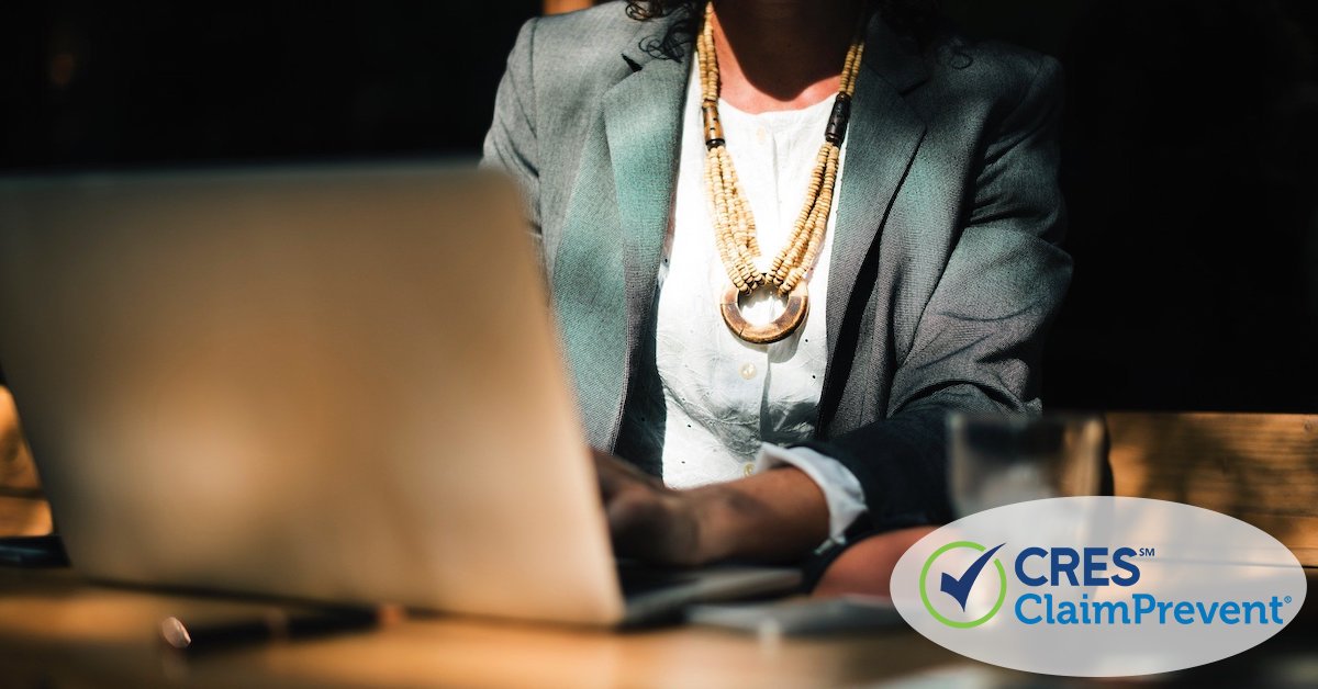 woman sitting at laptop doing work