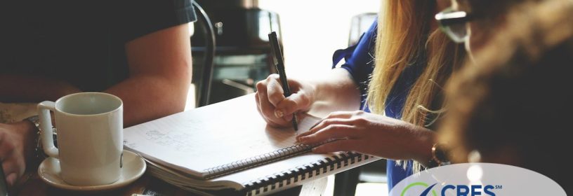 team meeting with woman taking notes