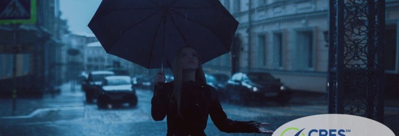 woman on street with umbrella in the rain