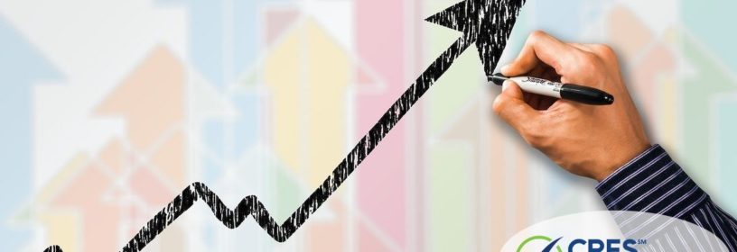 business graph arrow trending upward with person drawing in marker