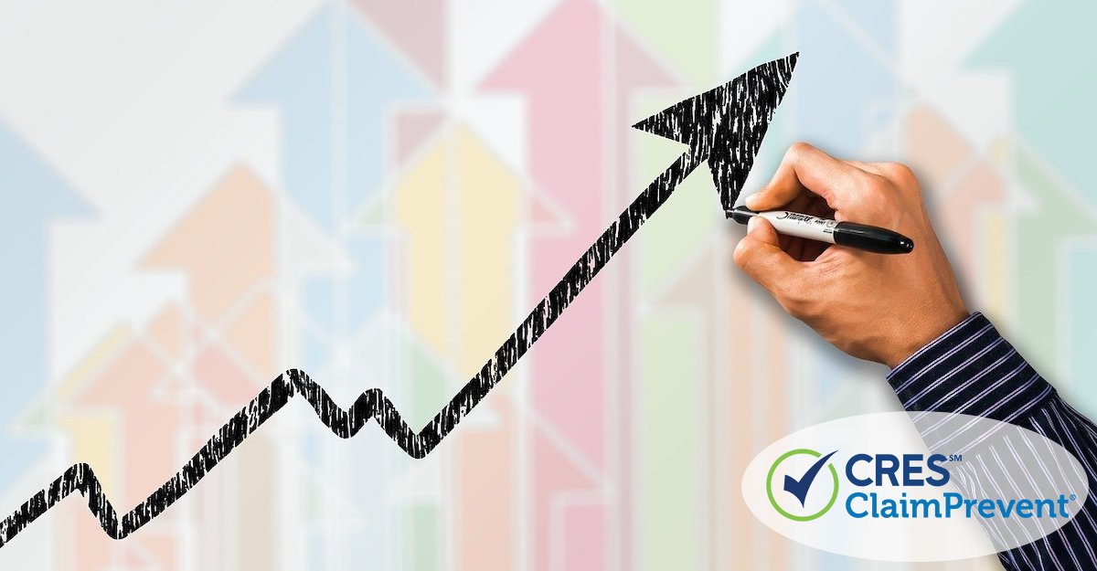 business graph arrow trending upward with person drawing in marker