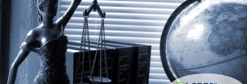 status on desk of lady justice holding scales
