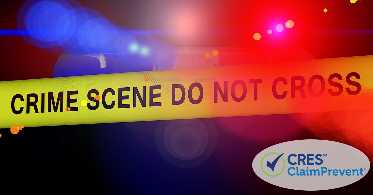 red and blue police lights with crime tape that says "crime scene do not cross"