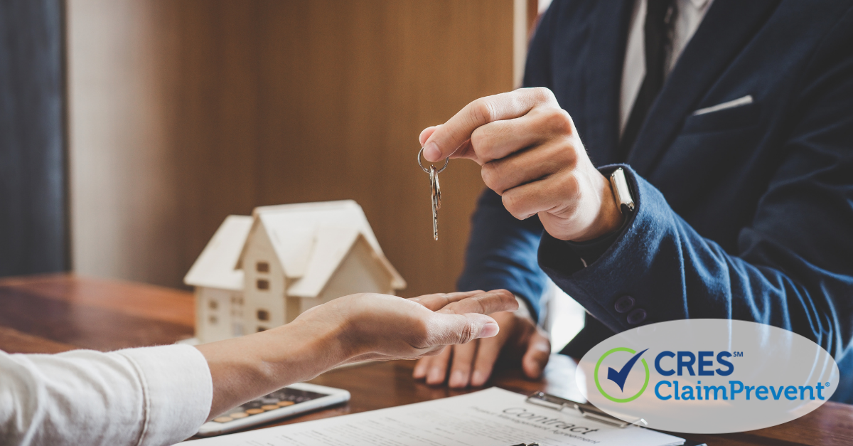 man handing keys with house